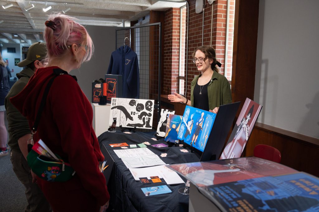 Senior Showcase photo of student interactiong with viewers